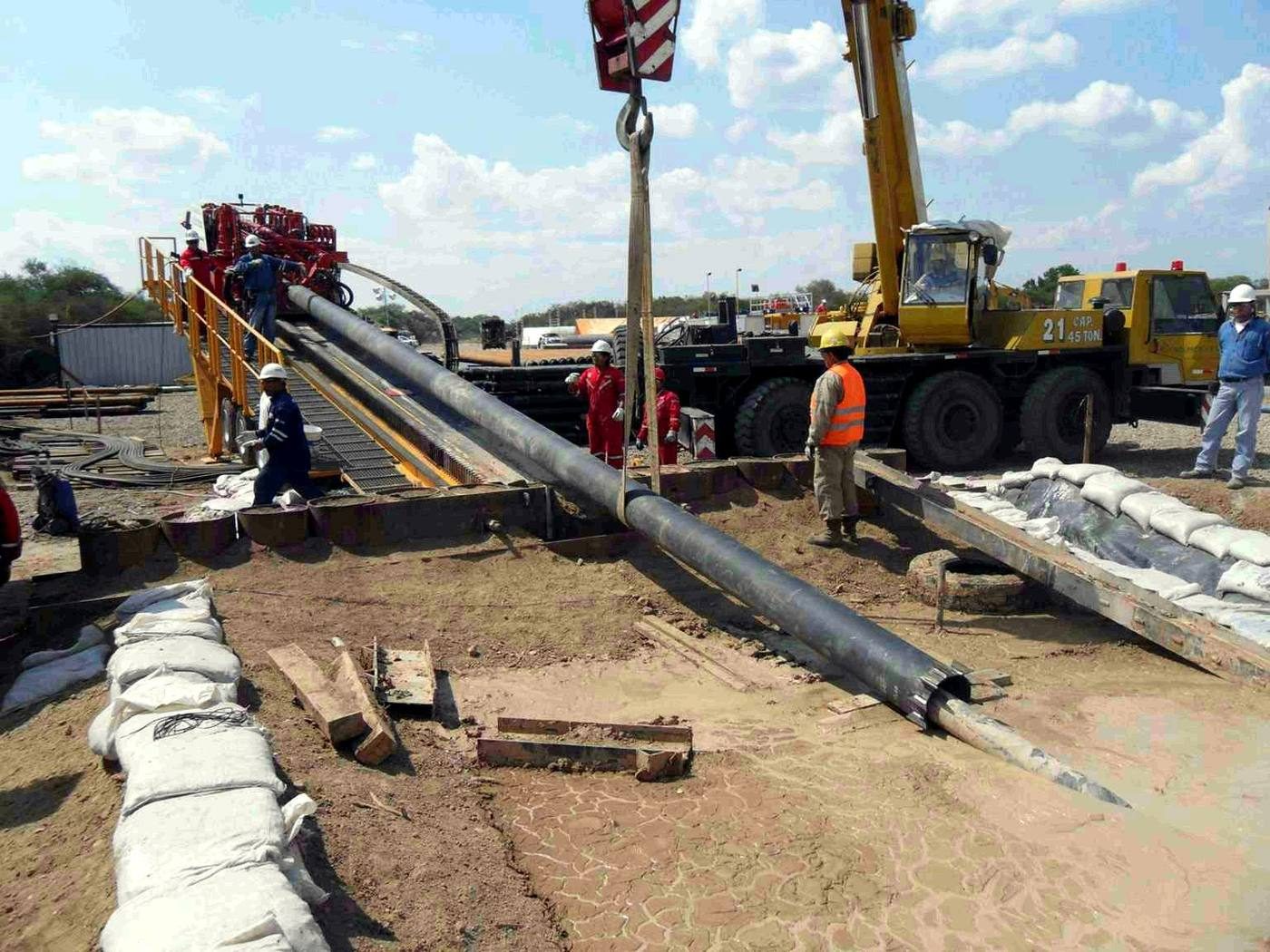Pipe string being lifted on site